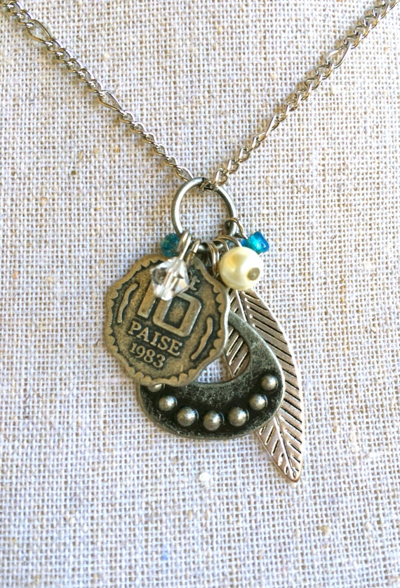 Items similar to Bits and Bobs Charm Necklace Coin and Feather