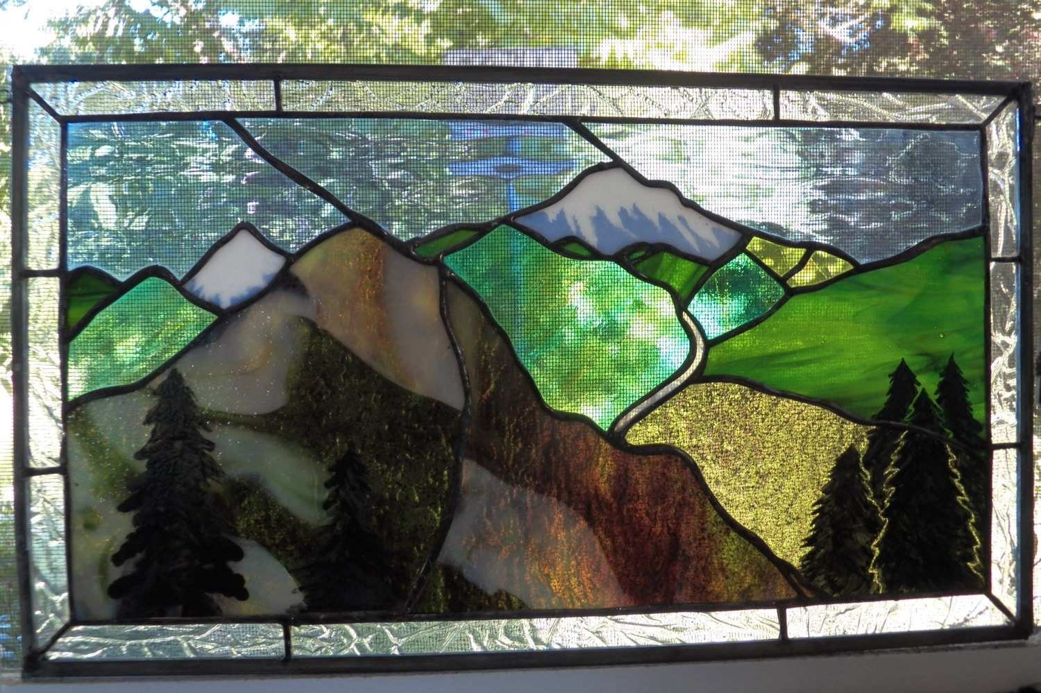 mountain view in stained glass with kiln fired painted trees