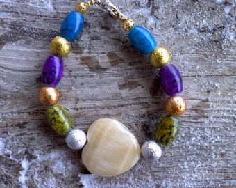 Calcite heart,misc. glass and metal beaded bracelet 7 3/4 inch