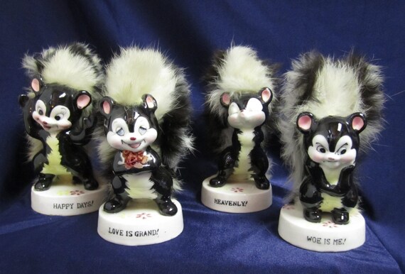 ceramic skunk figurines