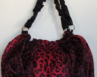 red animal print bag