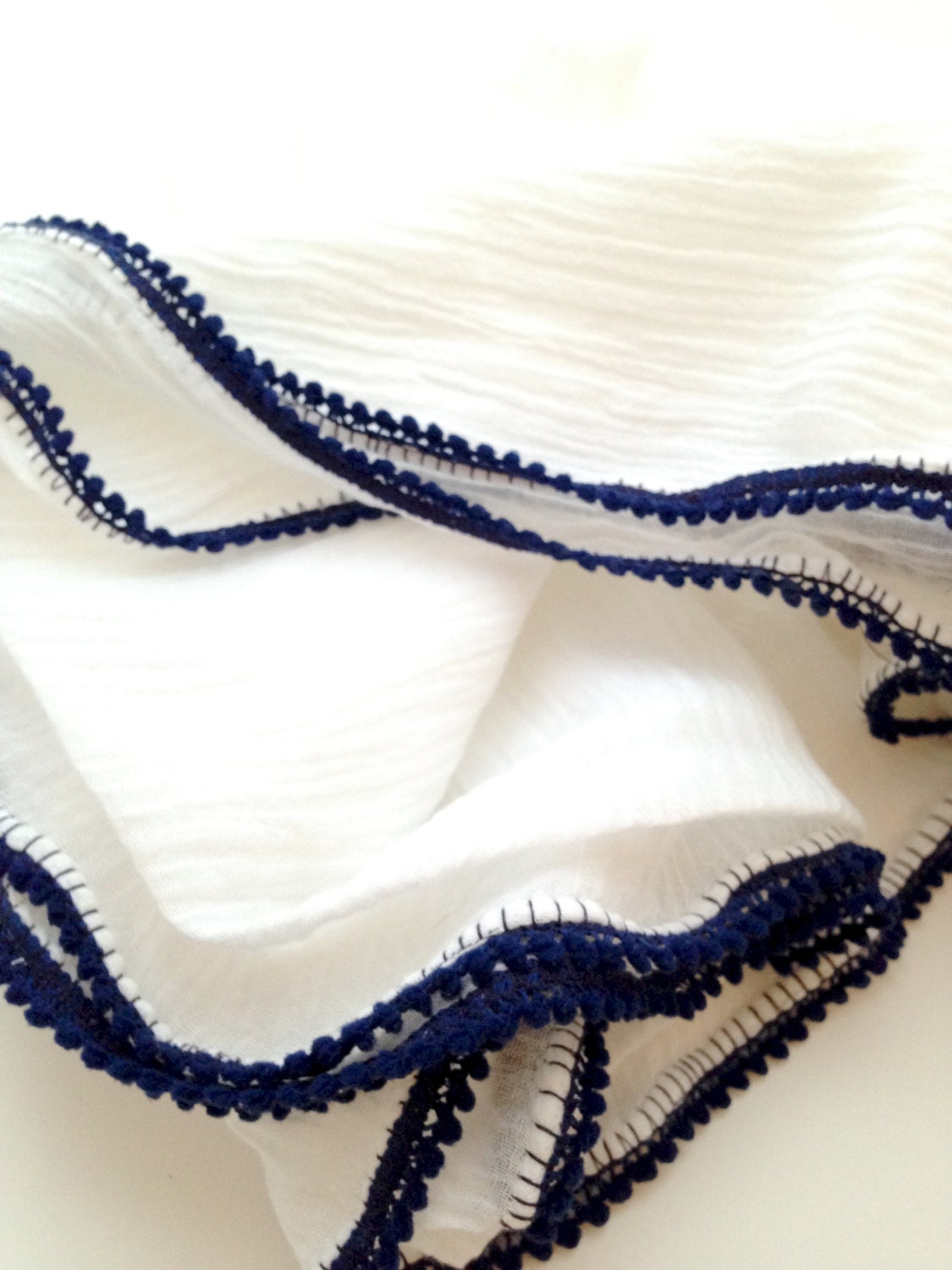 White and Navy Pom Pom Swaddle Blanket by