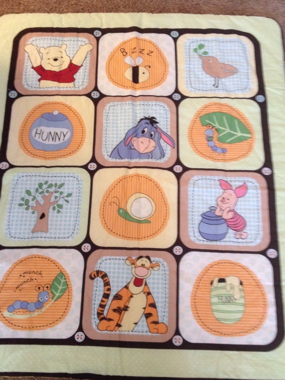 Items similar to Winnie the Pooh quilted blanket on Etsy