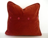Warm orange/poppy velvet-like velour cover with raspberry and tangerine buttons for 20-inch pillow insert.