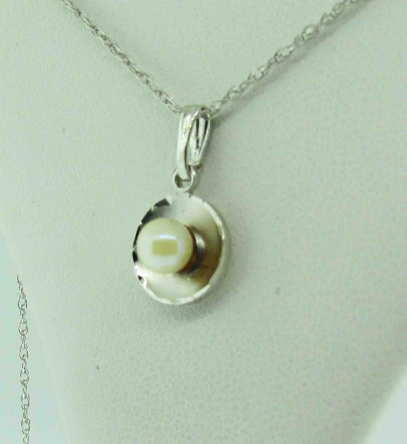Sterling Silver necklace with white pearl.