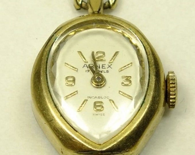 Storewide 25% Off SALE Vintage Ladies Arnex 17 Jewels Incabloc Swiss Made 10k Gold Watch featuring a flush set black & rhinestones on the li