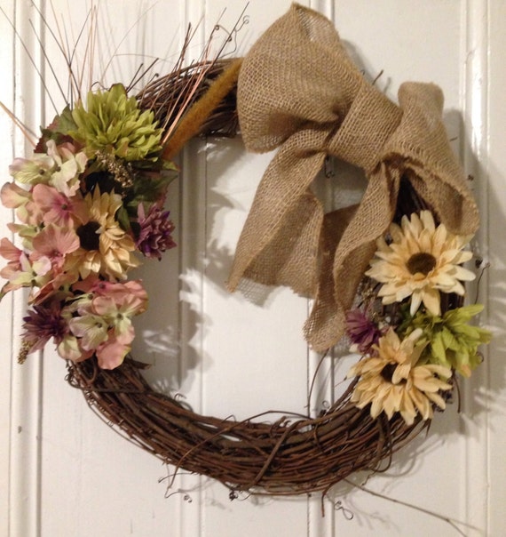 Items similar to Floral Grapevine wreath with burlap bow on Etsy