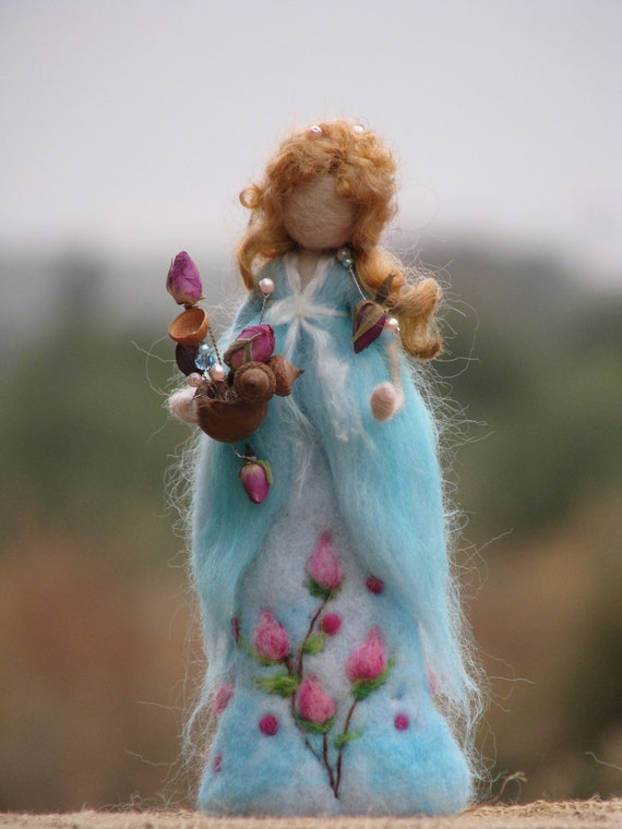 Needle felted waldorf inspired doll holding roses