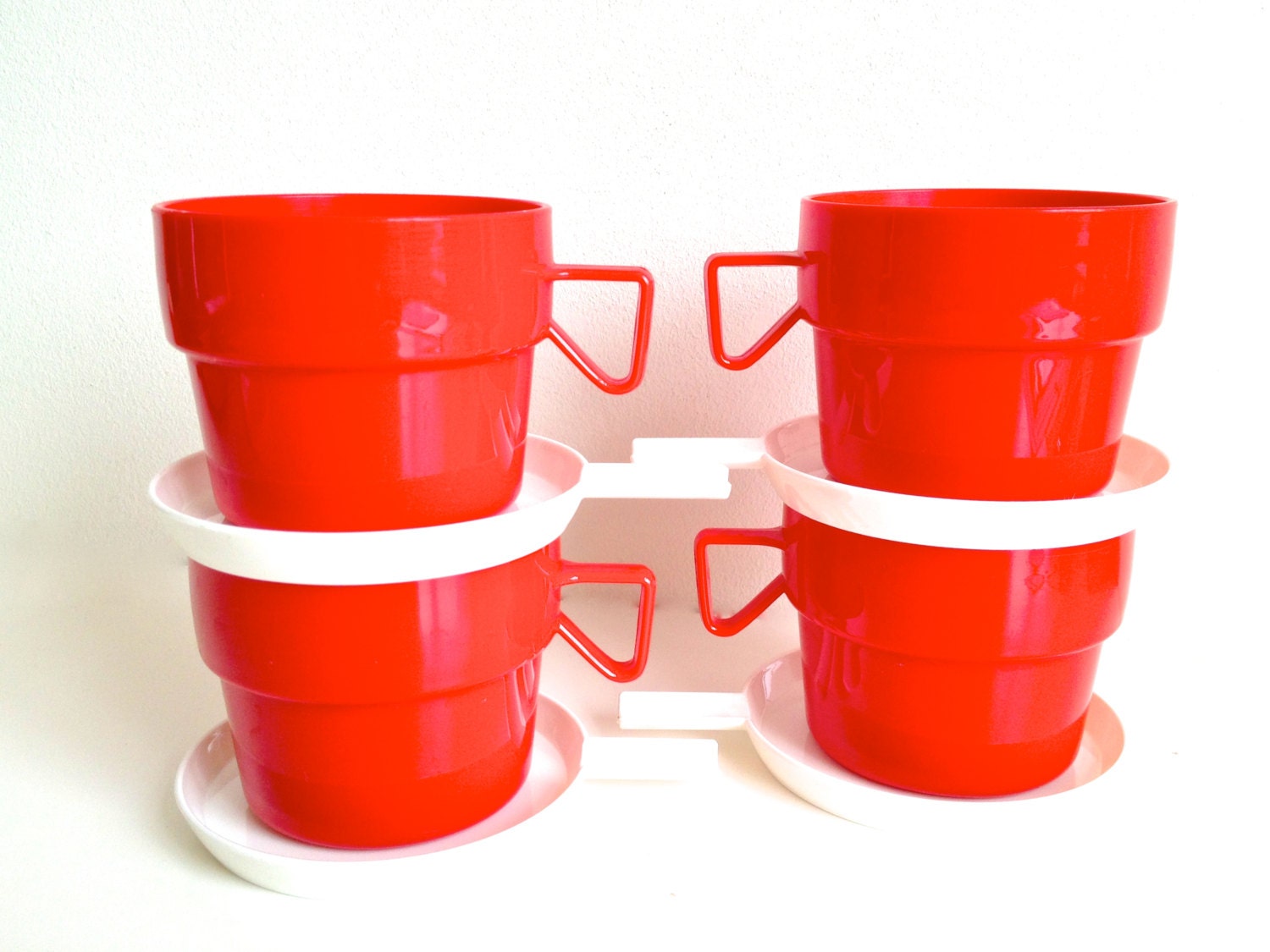 plastic tea cups with saucers