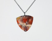 Eruption - pieces of lava shield pendant large enameled dimensional triangle, orange, yellow and white