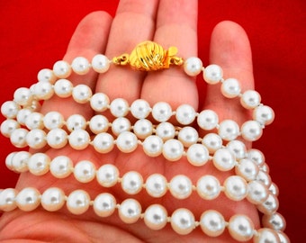 Vintage 31" necklace with hand knotted white pearls in great condition,appears unworn