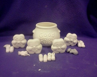 Dona's Shamrock Noggins 3" ready to paint with hands and feet with pipe cleaners.