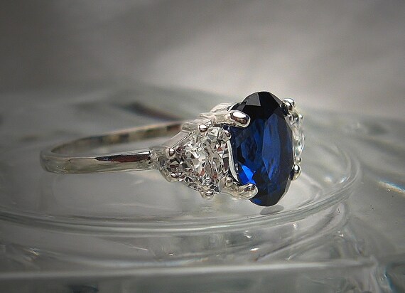Lab Blue Sapphire Oval Center Stone and 5mm Trillion White