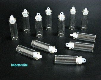 12pcs Mini Clear Glass Bottles Vials with Plastic Lid. H34W10. (#A11-2).