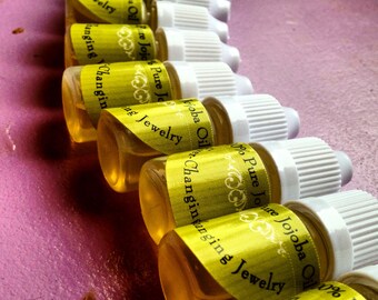 2 Bottles of 100% Pure Jojoba Oil- 5ml-Great for your lobes Wood Jewelry/Organic/Trending/Wooden Gauges/Wooden Plugs/Eyelets/Tunnels/Gages