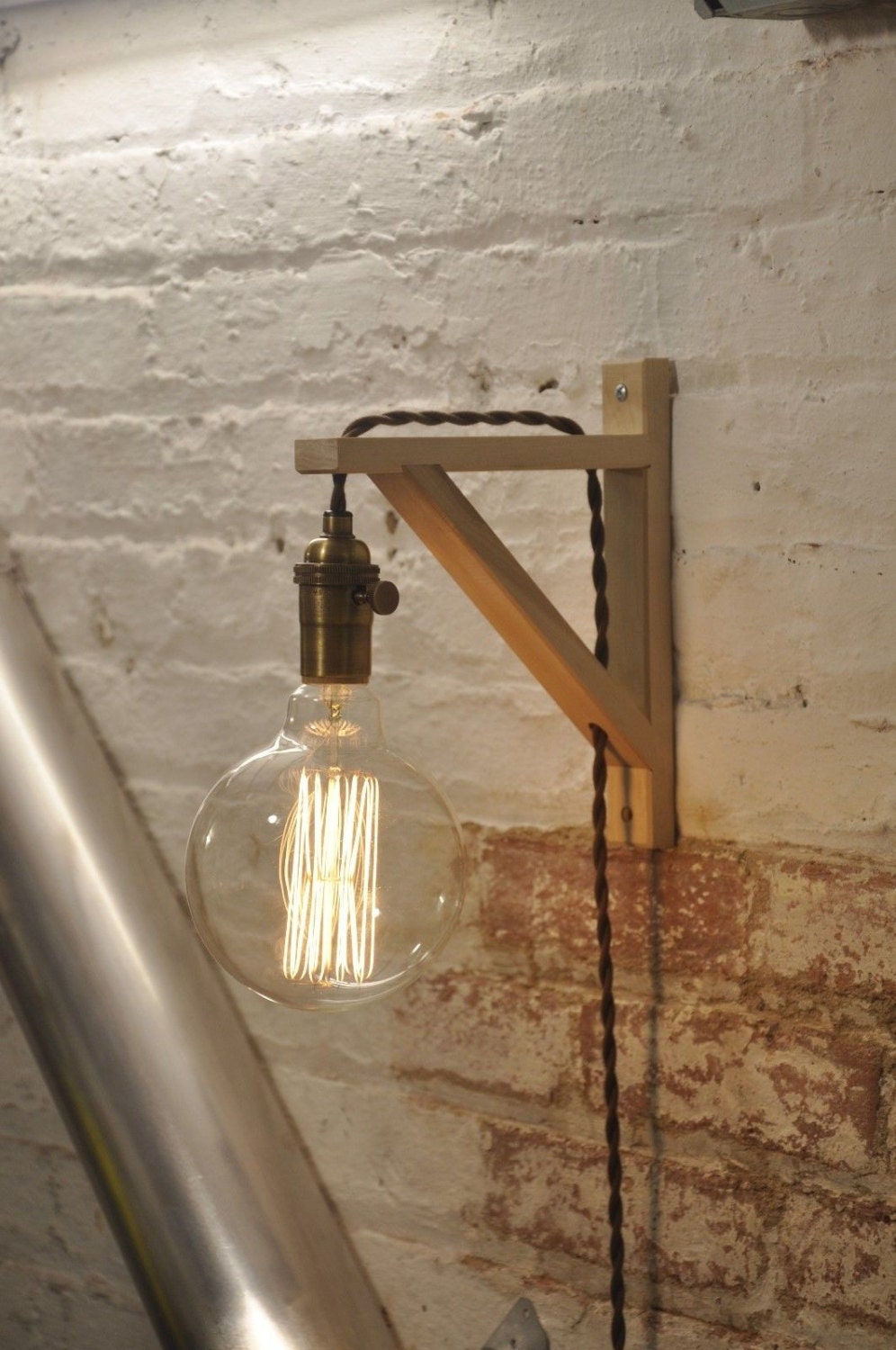 Brass plug in wall sconce