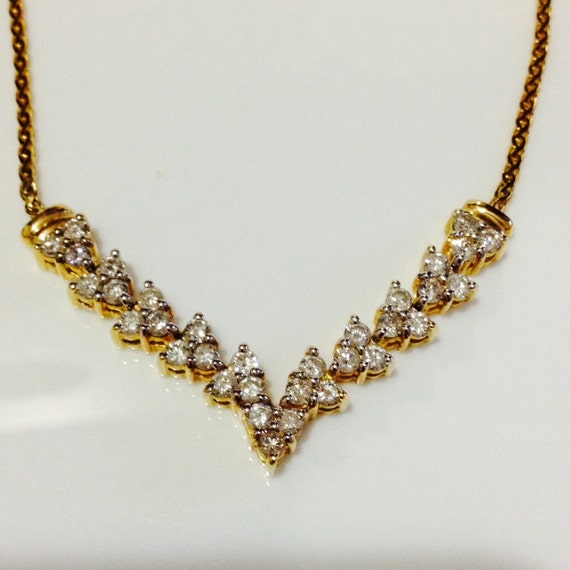 14k yellow gold Vshape diamond necklace 10.2 grams D1.20