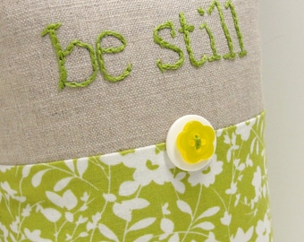 hand-embroidered pillow - "be still" in green on natural linen with white and green floral print- serene, calm, meditation, tranquility