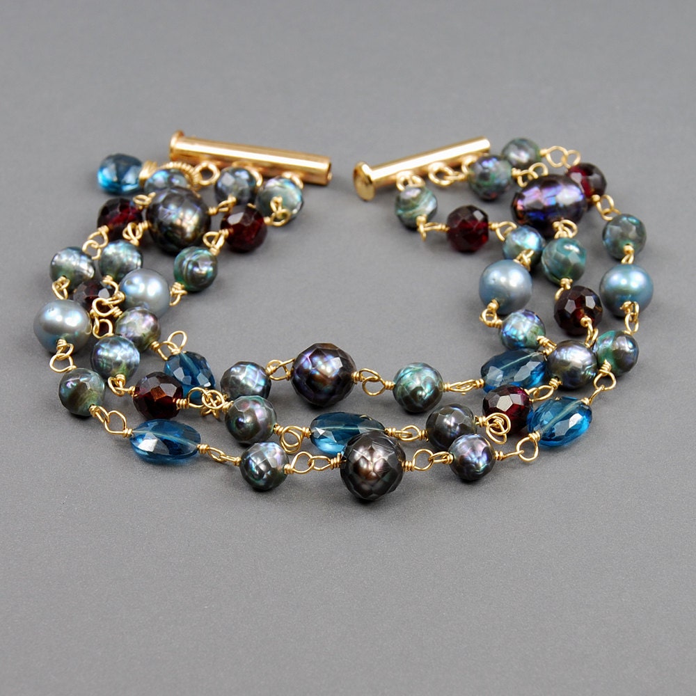 London Blue Topaz Garnet and Pearl Bracelet by Agusha. London