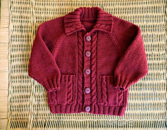 Hand knitted red baby cardigan with cables & pockets fit 9-12
