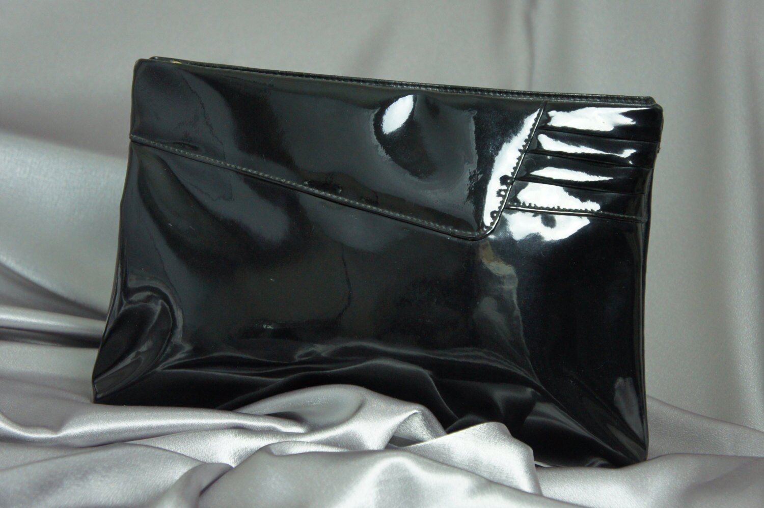 black patent clutch bag next