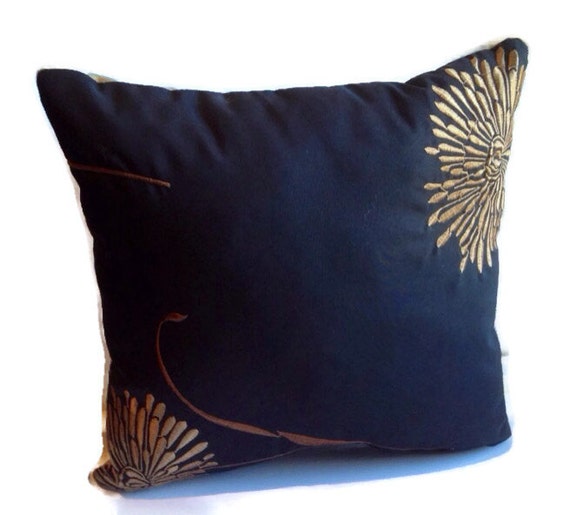 Black Decorative Throw Pillow with shades of brown and gold