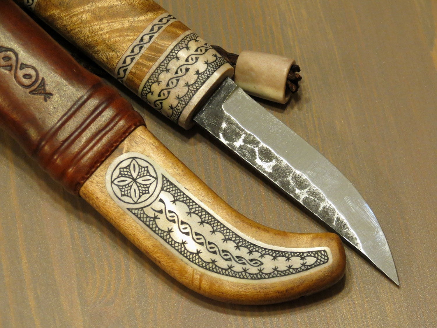 Hunting knife. Scandinavian style. Deer antler and curly
