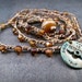 Rustic Amber Crochet Necklace, or wrap bracelet, Patina brass "Lie Detector" pendant, Bohemian Jewelry