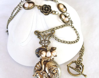 Art Nouveau pocket watch pendant with fresh water pearls and rose accents.