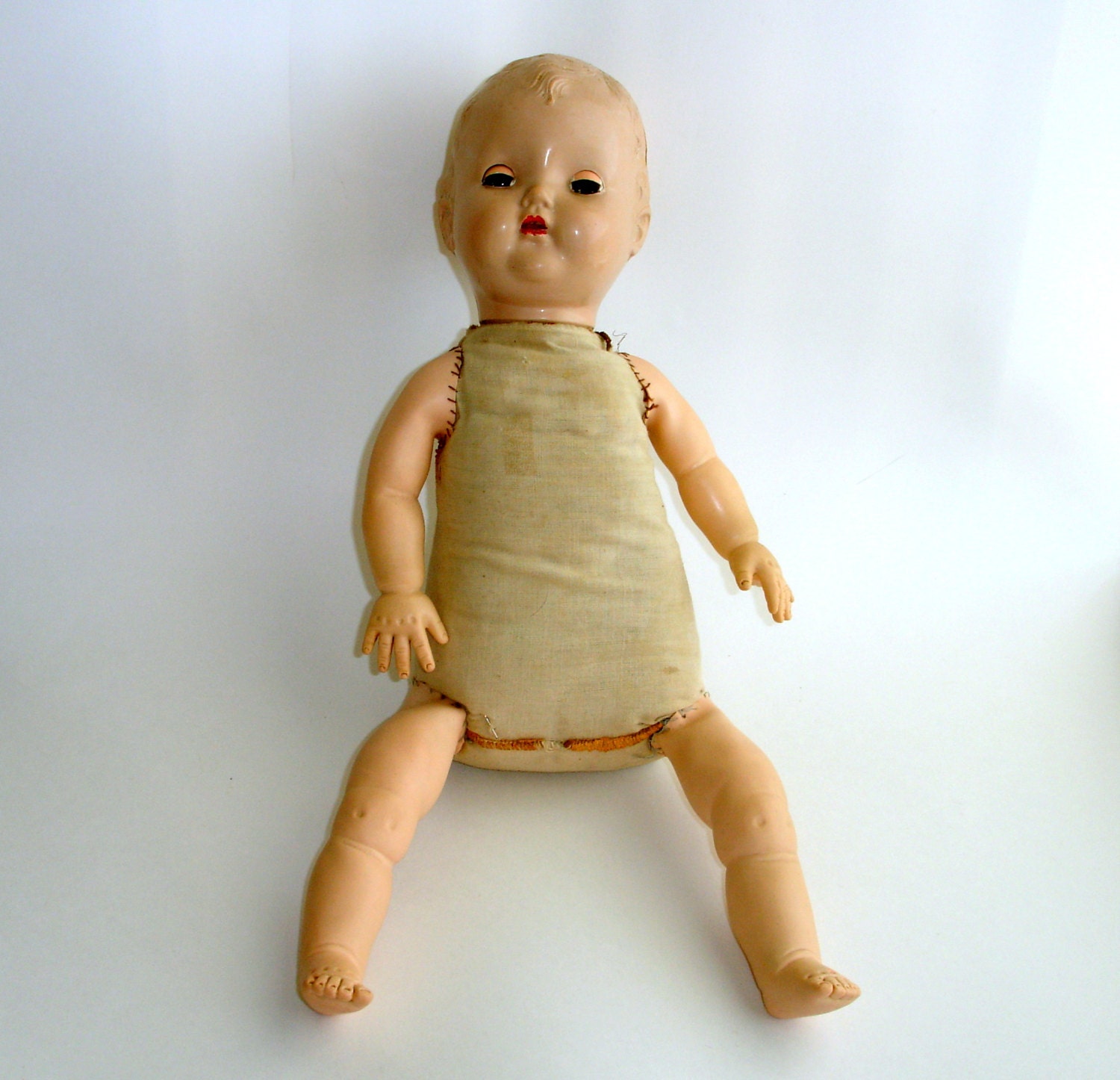 old small plastic dolls