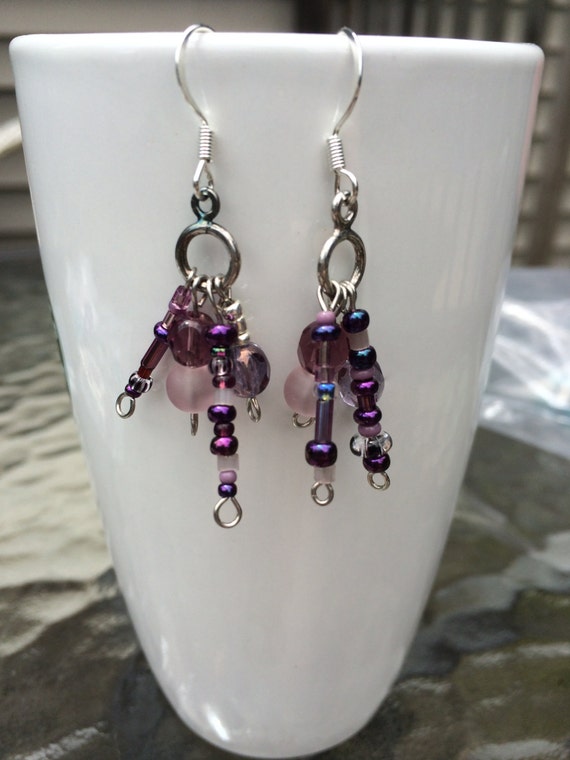 Items similar to Purple bohemian dangle earrings with czech glass, sea glass, and seed beads. on