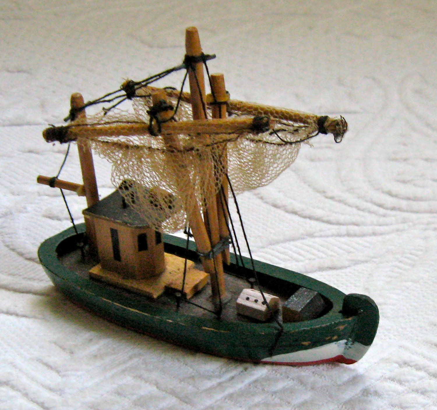 wooden fishing boat . fishing boat with nets . toy fishing