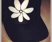 Black trucker with hand painted white Tiare