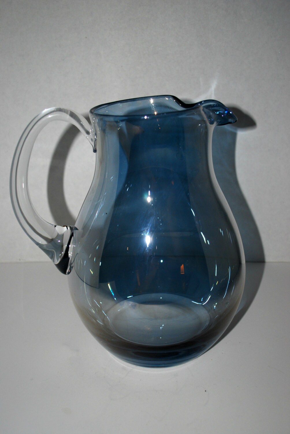 blue glass iridescent glass pitcher applied handle vintage