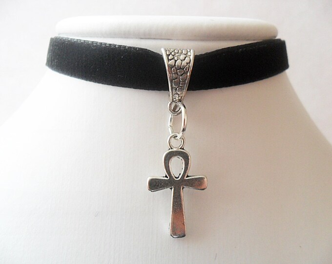 Black velvet choker necklace with silver ankh pendant and a width of 3/8” inch.