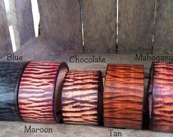 Our unique, one of a kind leather Wristband that is hand- dyed and made to order and can be personalized too!!!