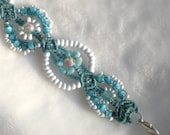 Blue Rose Lace micro macrame cuff bracelet in white and blue with  pink rose beads on turquoise nylon cord.