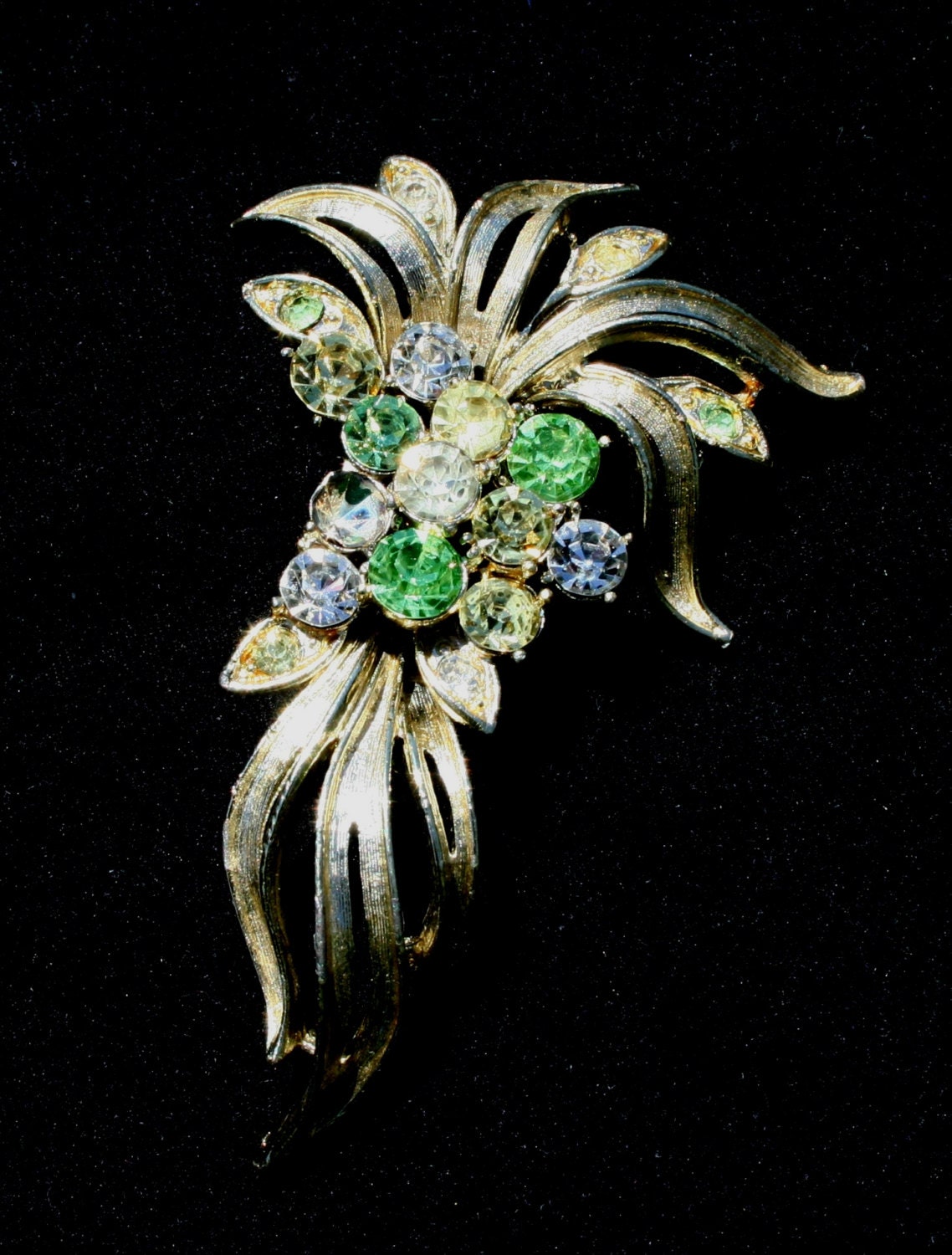 Brooch from 1950’s. Good quality costume jewelry with emerald and