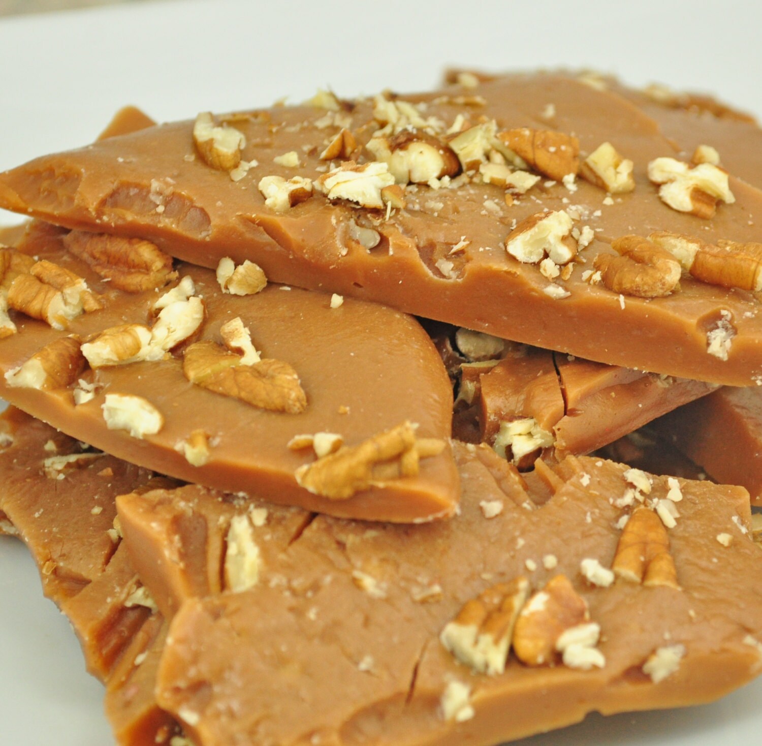 Hard buttery Caramel brittle with chopped pecan layer 3/4