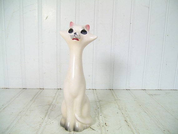 white ceramic cat figurine