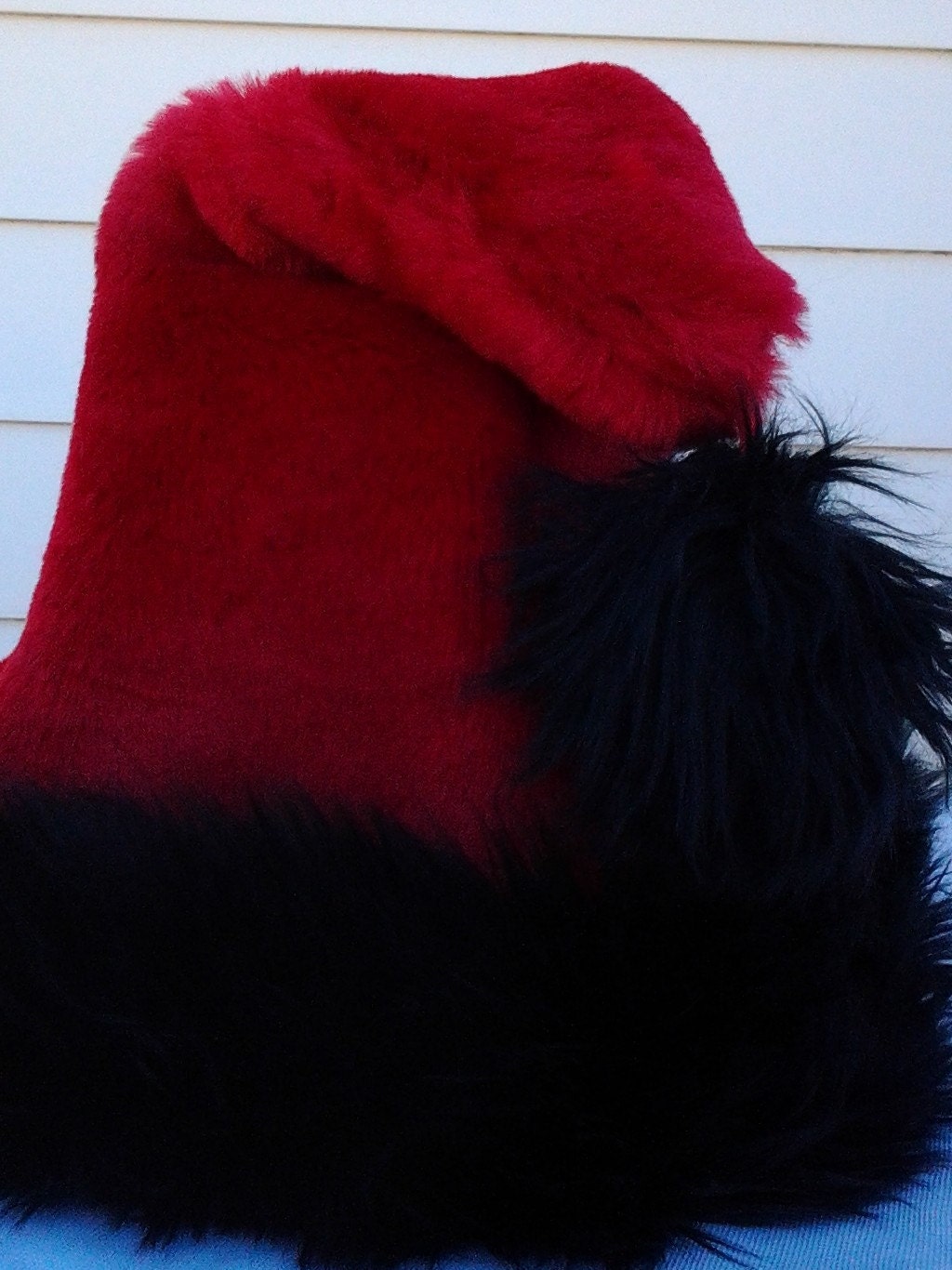 red santa hat with short and shaggy black trim options red santa hat with short and shaggy black trim options