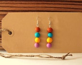 Beautiful colorful earrings of different color beads; blue, lilac, brown and yellow (made of polymer clay