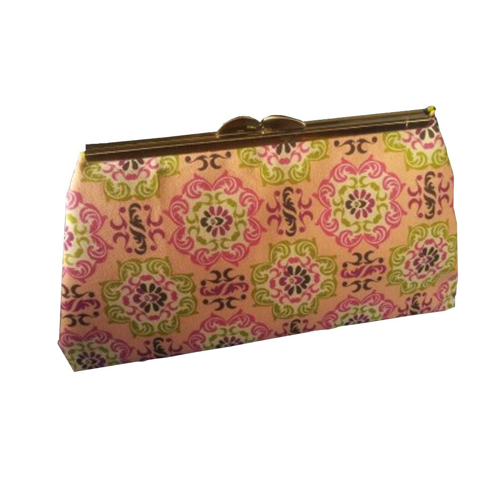 green and pink clutch bag