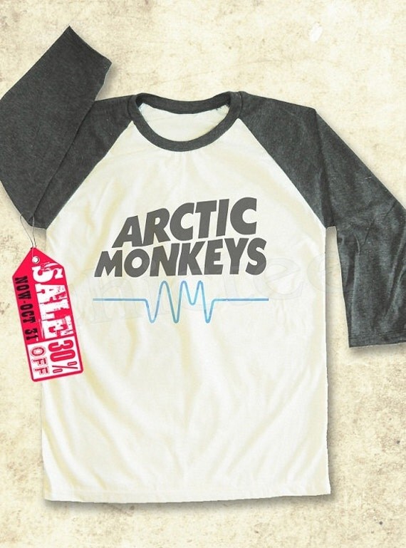 Arctic monkeys ladies t shirt Make a bold statement with our Arctic Monkeys T-Shirts, or choose from our wide variety of expressive graphic tees for any season, interest or occasion. Whether you want a sarcastic t-shirt or a geeky t-shirt to embrace your inner nerd, CafePress has the tee you're looking for.