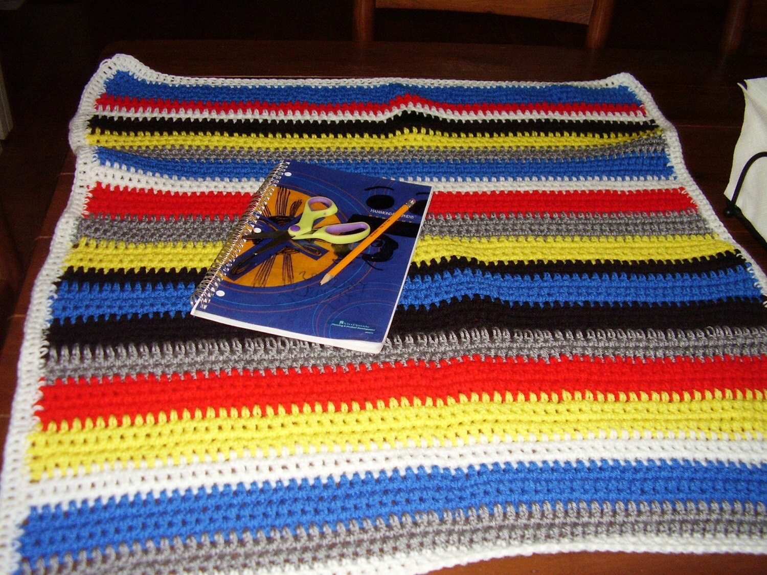 Crochet baby blanket in primary colors