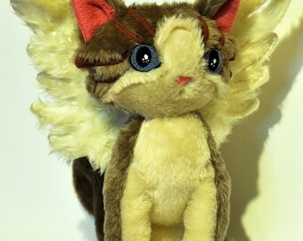 stuffed cat with wings