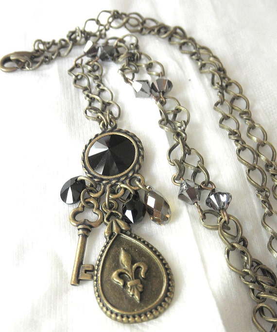 Black and Antique Brass Charm Necklace. Fleur de luis and Key Charm Necklace for Her