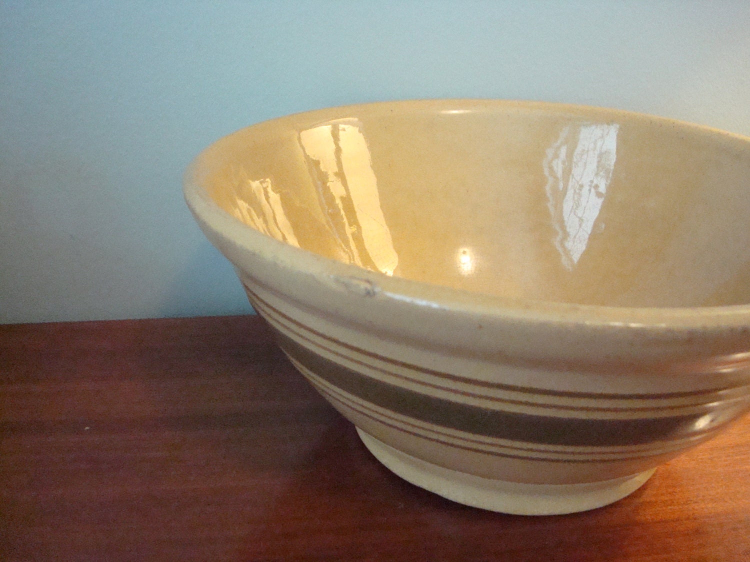 Nice vintage yellow ware pottery bowl with brown stripes