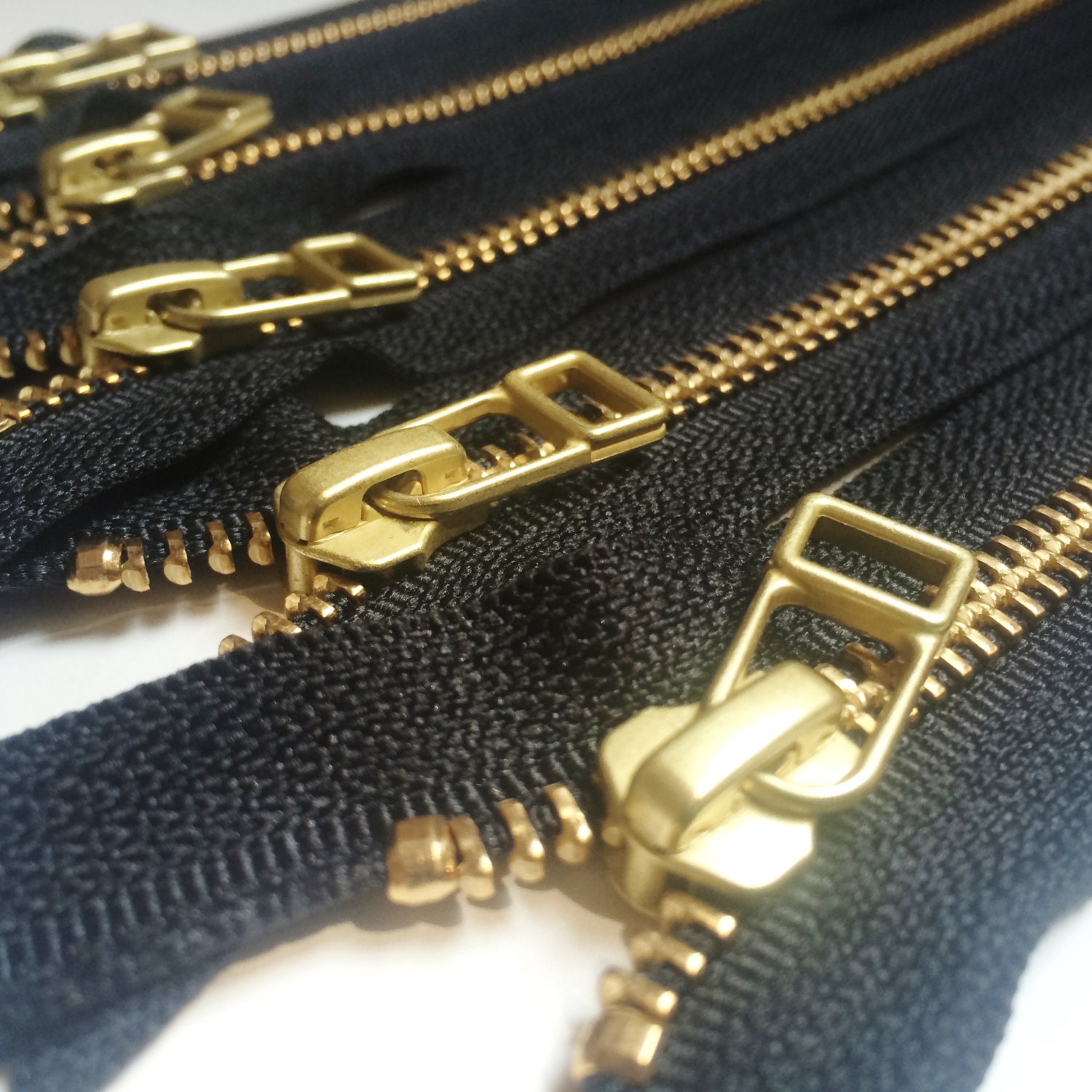 YKK metal zippers with gold brass teeth and DHR Wire style