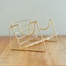 mid century brass tone rack for books, albums, CDs
